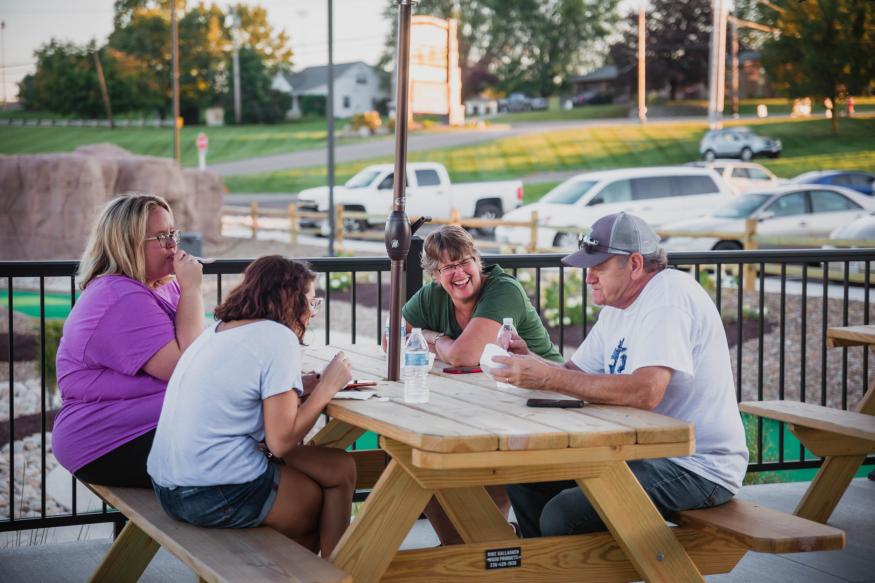 Group Eating Ice Cream at Table