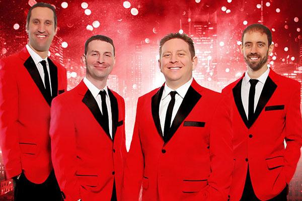 older men in red tuxedos standing together