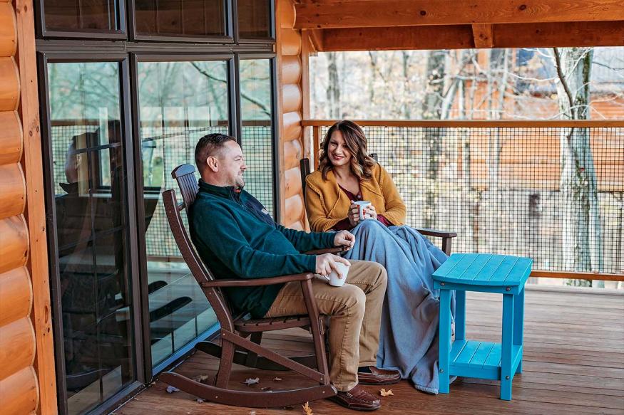 Couple sitting on cabin patio