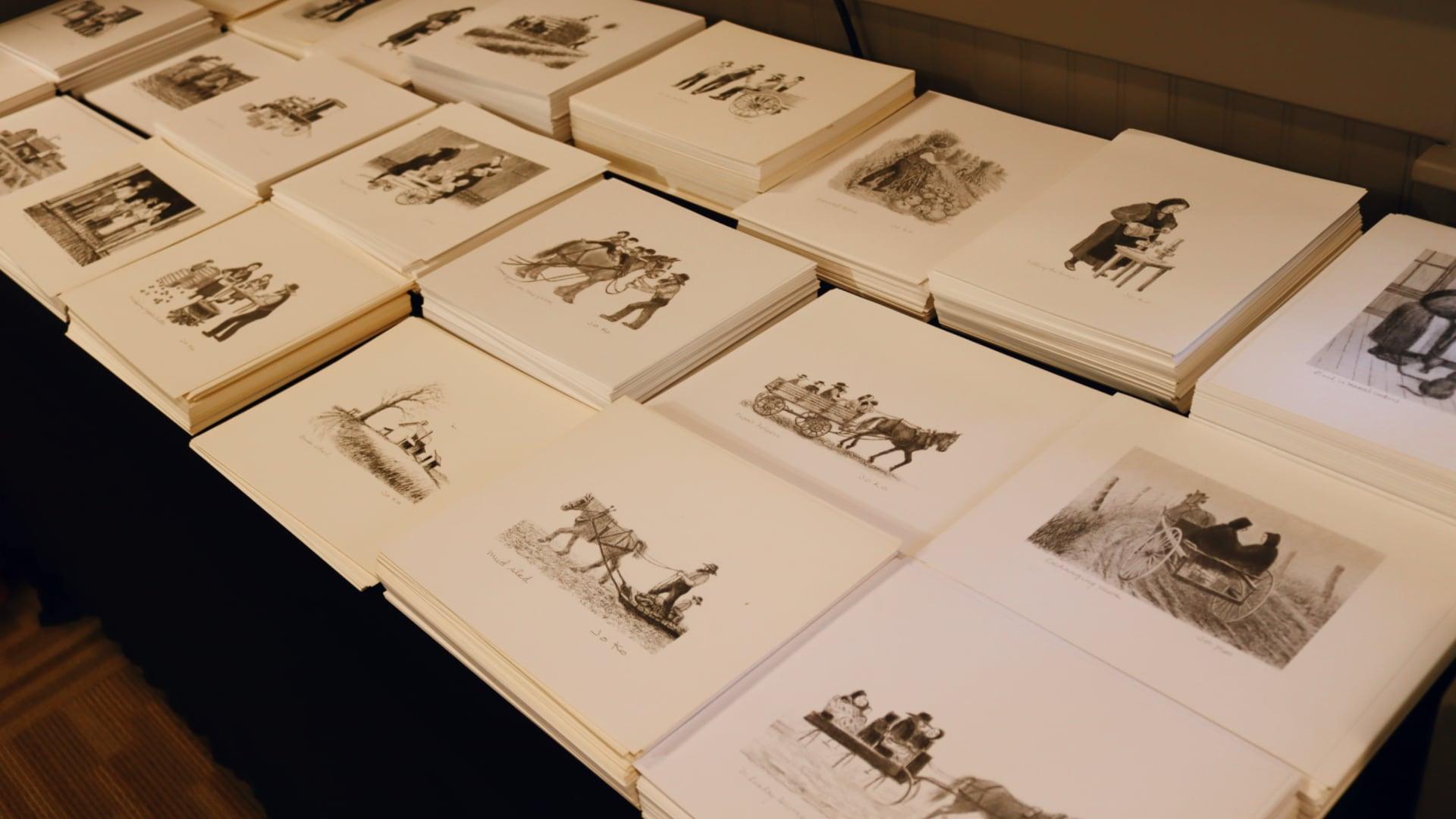 Prints of lithograph drawings on display