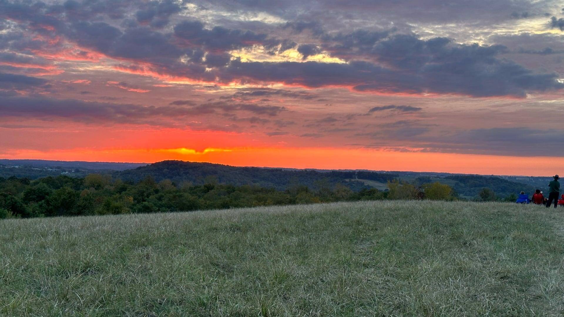Sunset viewed from the top of a hill at Legacy Point Park