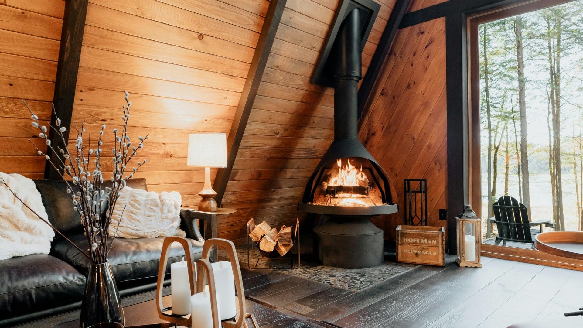 Fireplace in the corner of a cozy A-Frame retreat