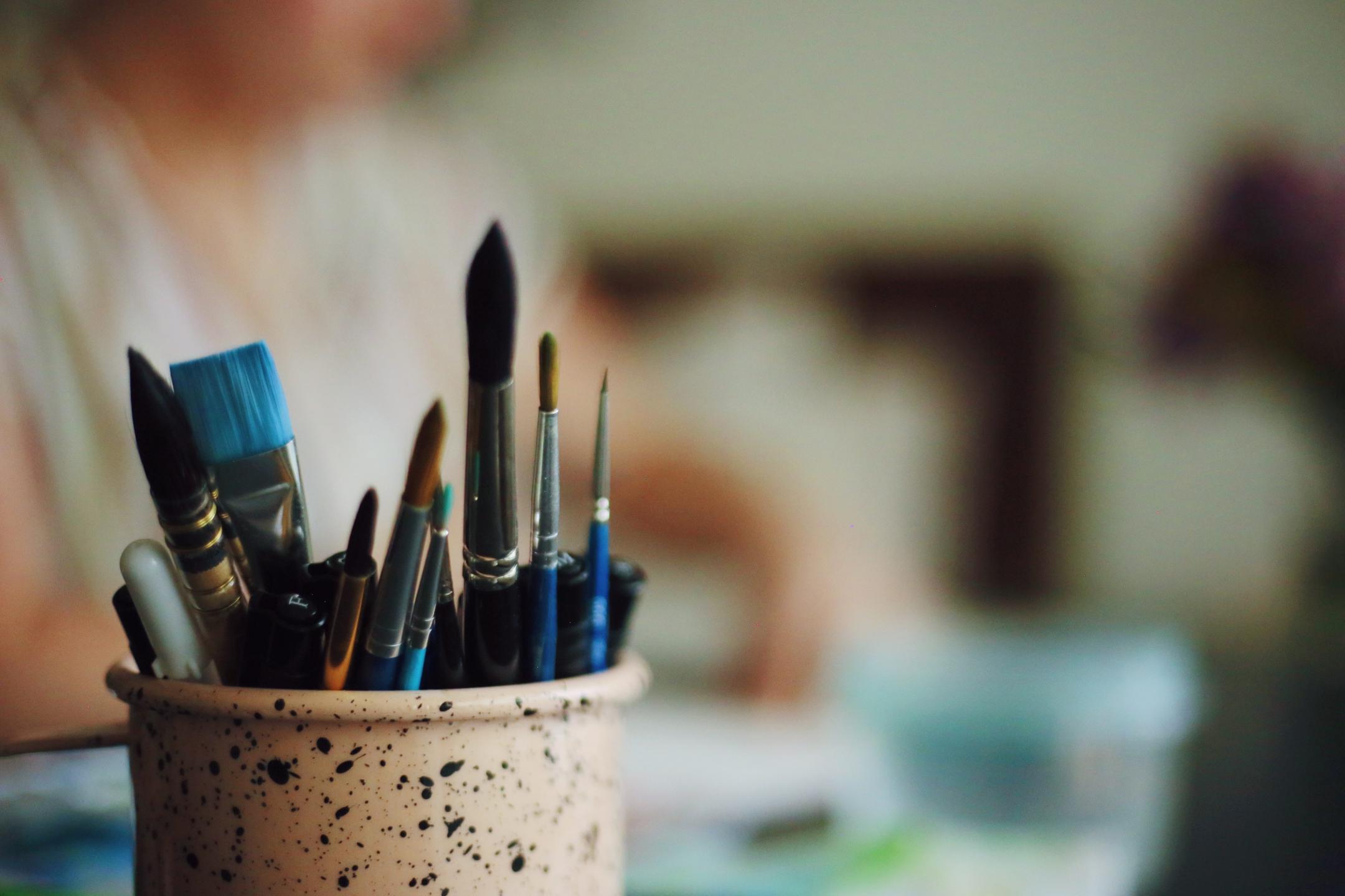 paint brushes in a cup